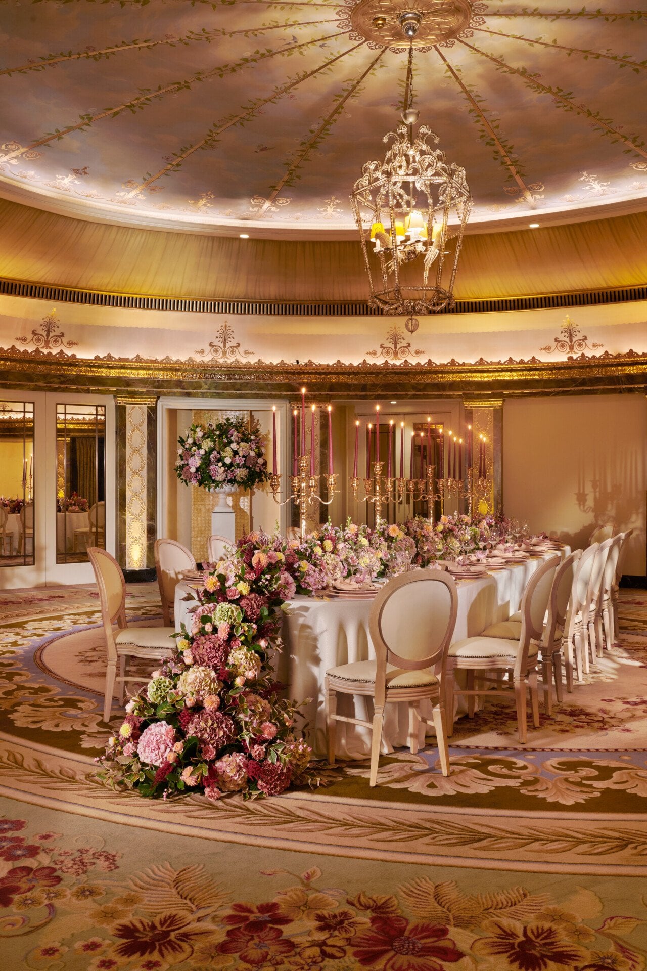 The Dorchester Gold and Silver event space set of  fabulous evening event with a stunning floral centre perice