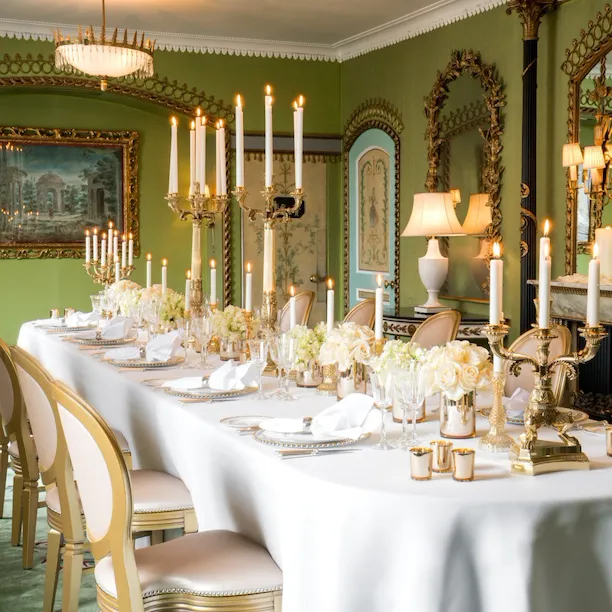 The Dorchester-Pavilion set up dinner with white flowers down the table and cut crystal glassware with candelabras