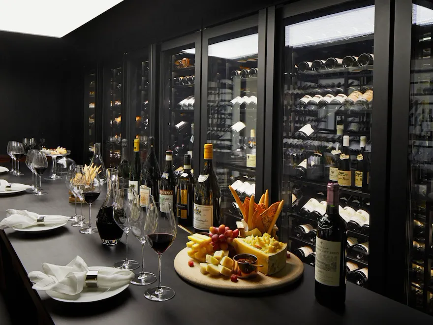 The Dorchester The Wine Vault, red wine being poured and cheese and fruit