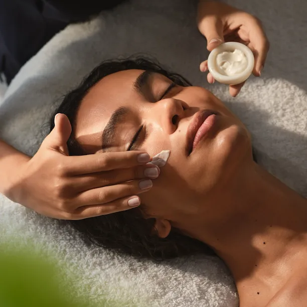 Guest receiving a facial treatment at The Spa at Coworth Park, a Dorchester Collection hotel