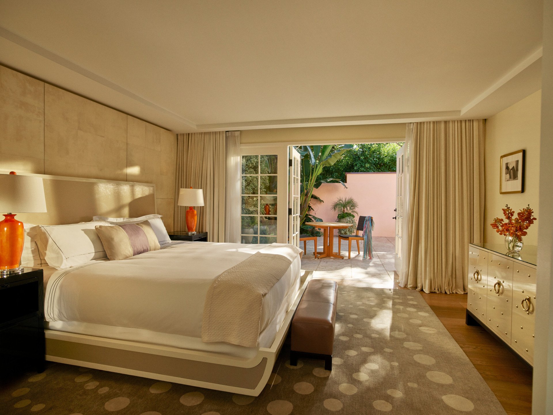 Patio Suite bedroom with open patio doors at Hotel Bel-Air, Los Angeles