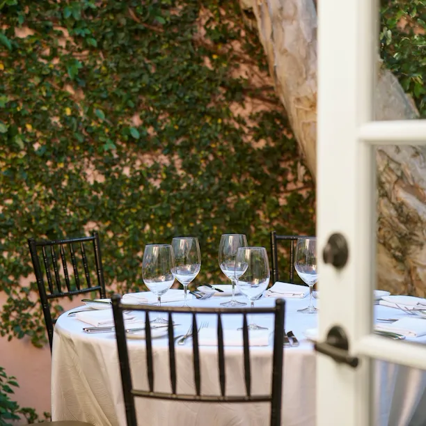 Table setting on the patio of a hospitality suite in Hotel Bel-Air.