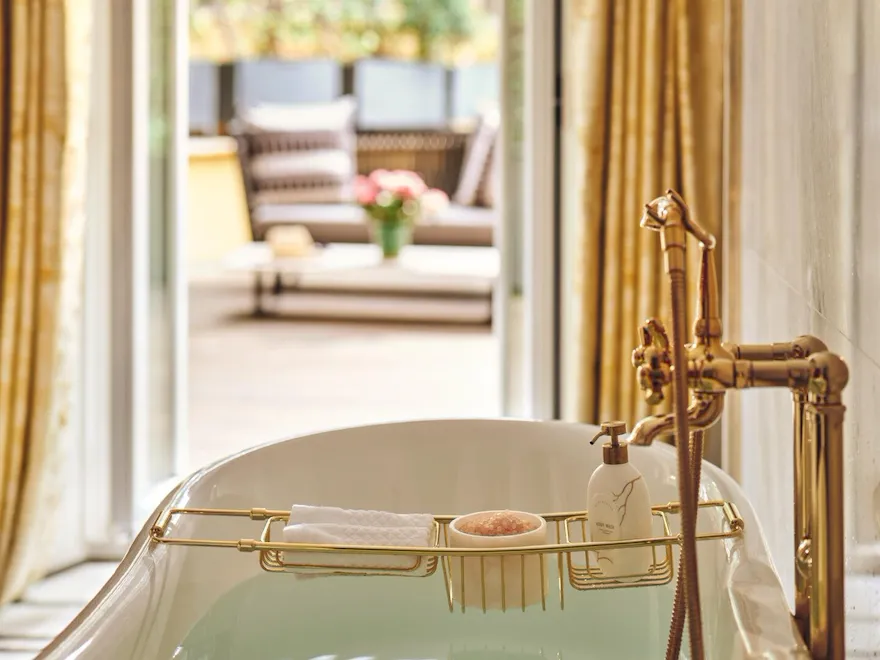 Bathtub filled with water in Aurora Terrace Suite at Hotel Eden rome
