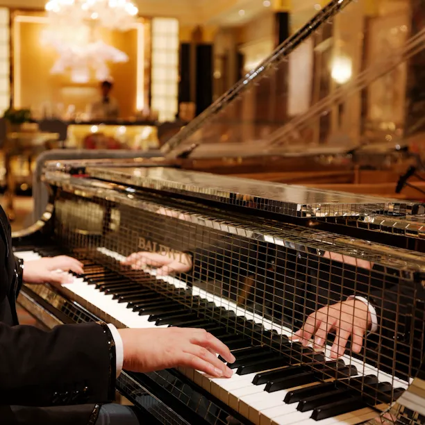 The Dorchester Artists Bar Liberace Piano close up with pianist playing