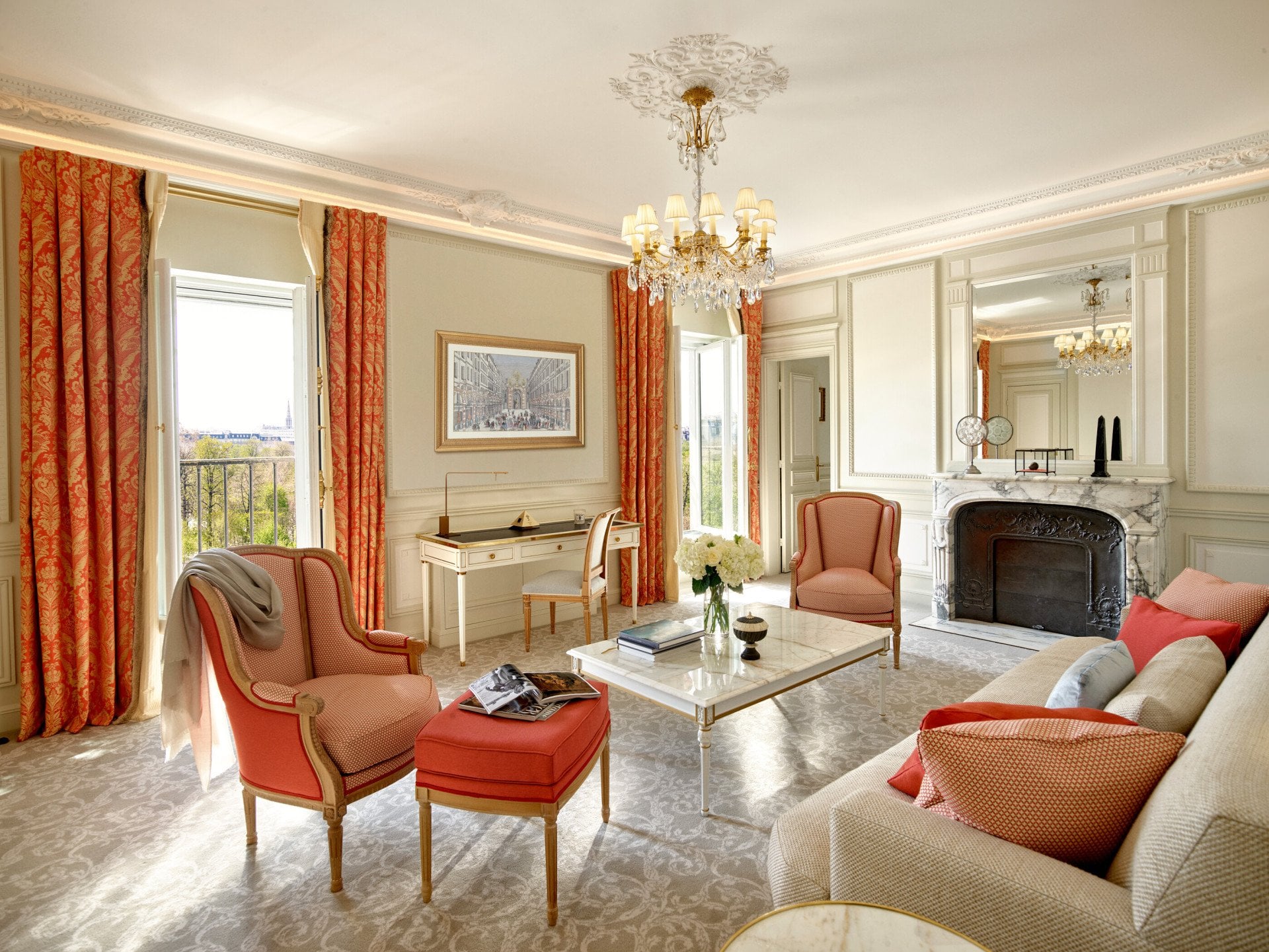 Executive suite living room with open doors to Tuileries garden view at Le Meurice, Paris