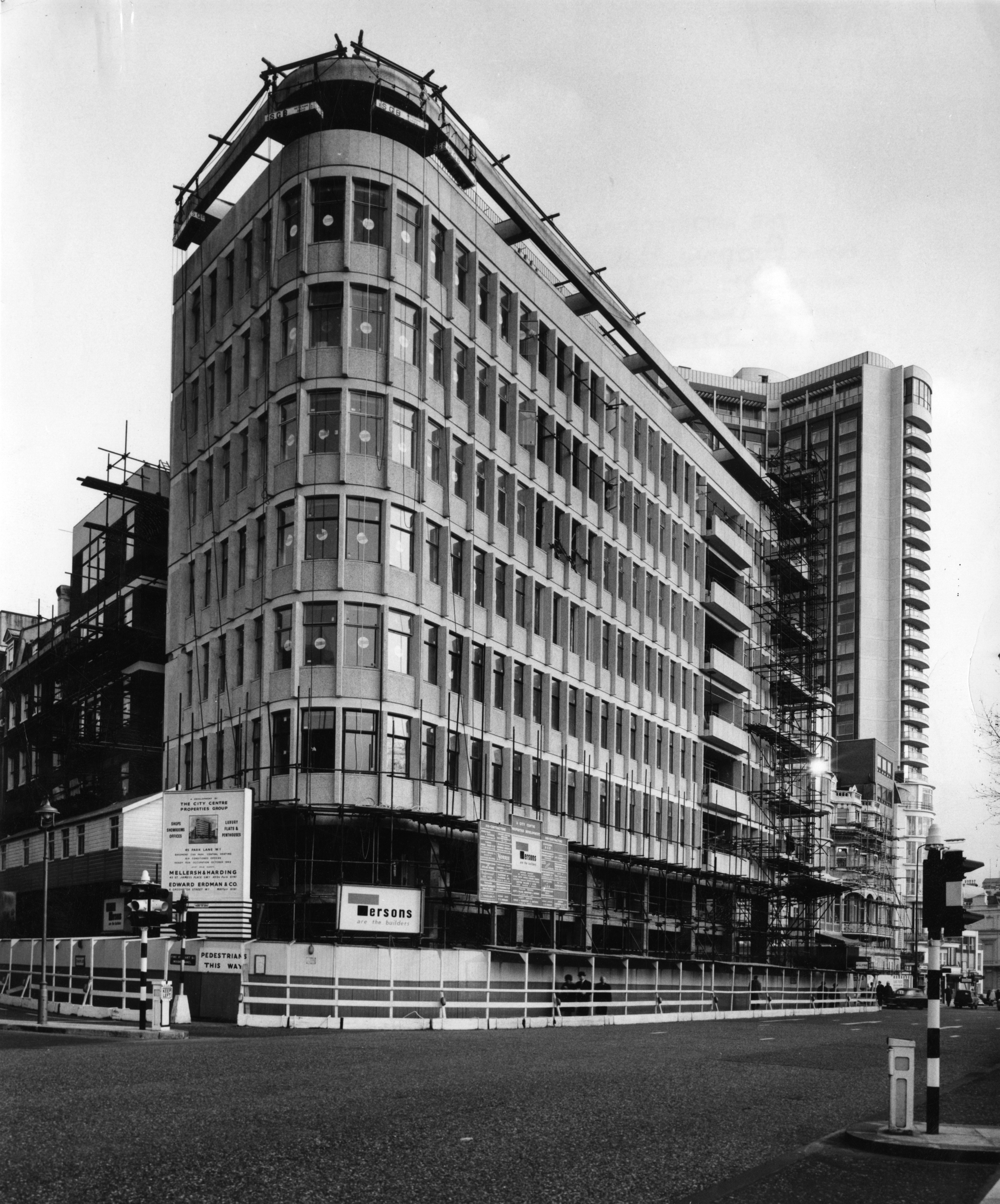 Black and white image of hotel being constructed