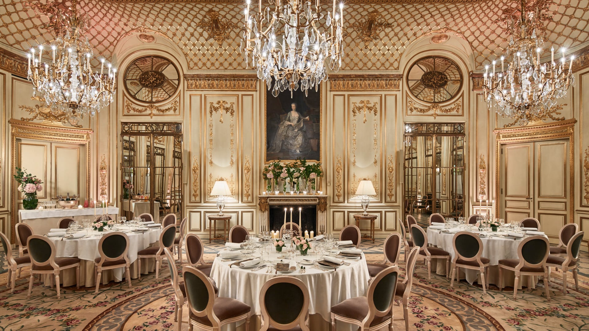 Photo of Salon Pompadour bright Versailles-style event room, set for dinner with three round and large dressed tables at Le Meurice, Paris