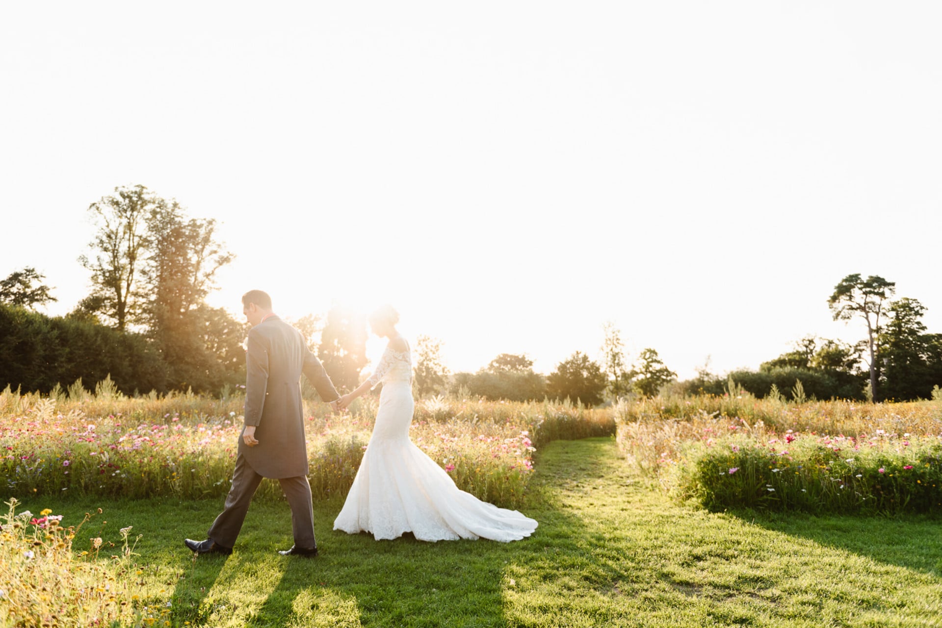 Coworth Park-Weddings-Meadow couple sunset-Credit Fiona Kelly