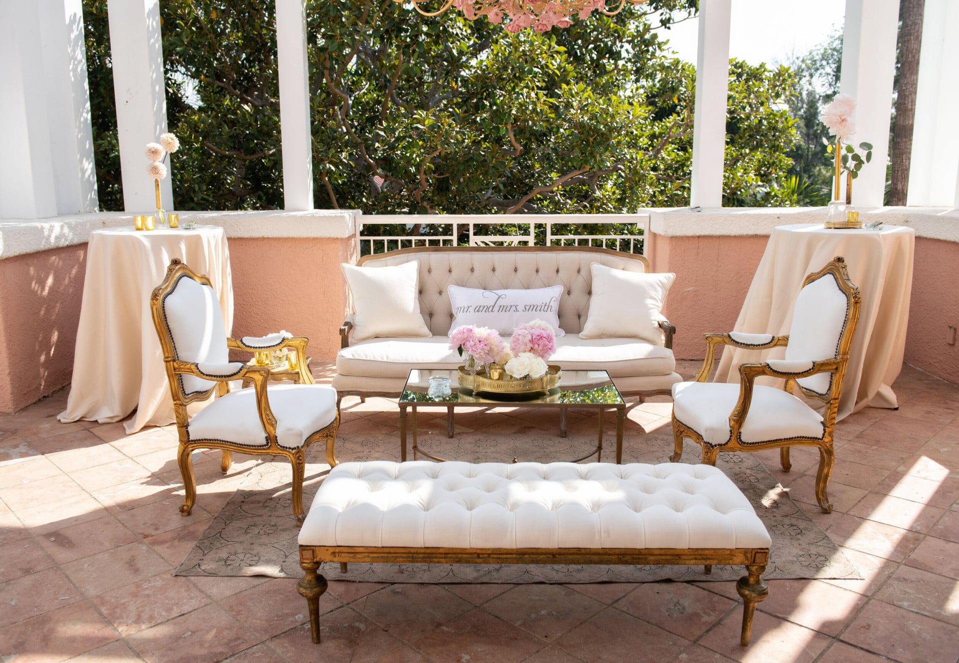 Elegant cream colored furniture for an outdoor sitting area on the Rodeo Ballroom's balcony  