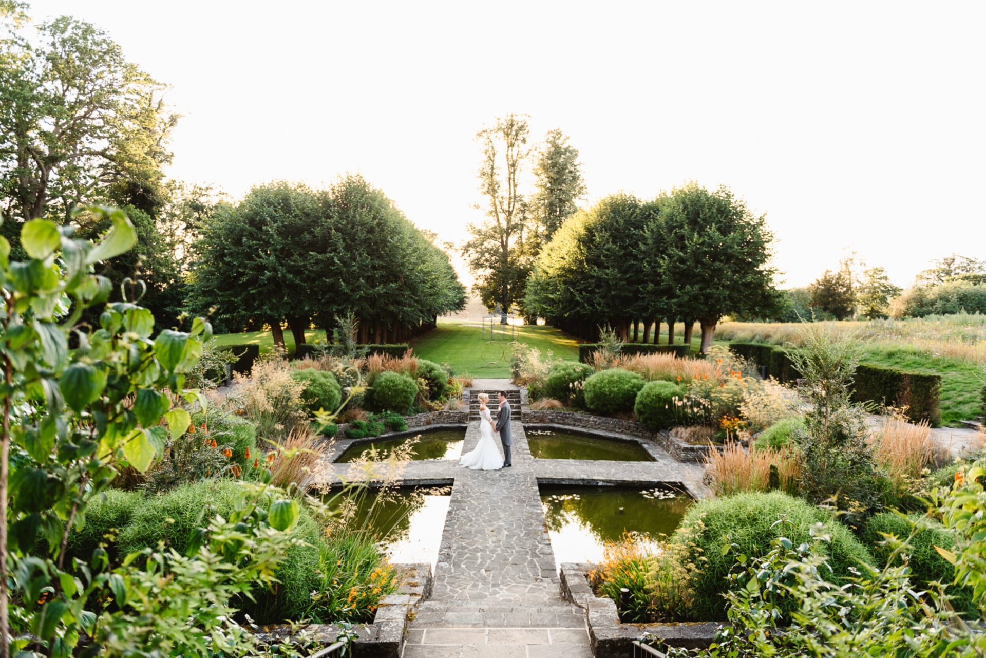 Coworth Park-Weddings-Sunken Gardencouple-Credit Fiona Kelly