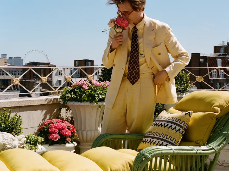 Luke Edward Hall on the Oliver Messel Suite Terrace at The Dorchester, stood next to his terrace designs