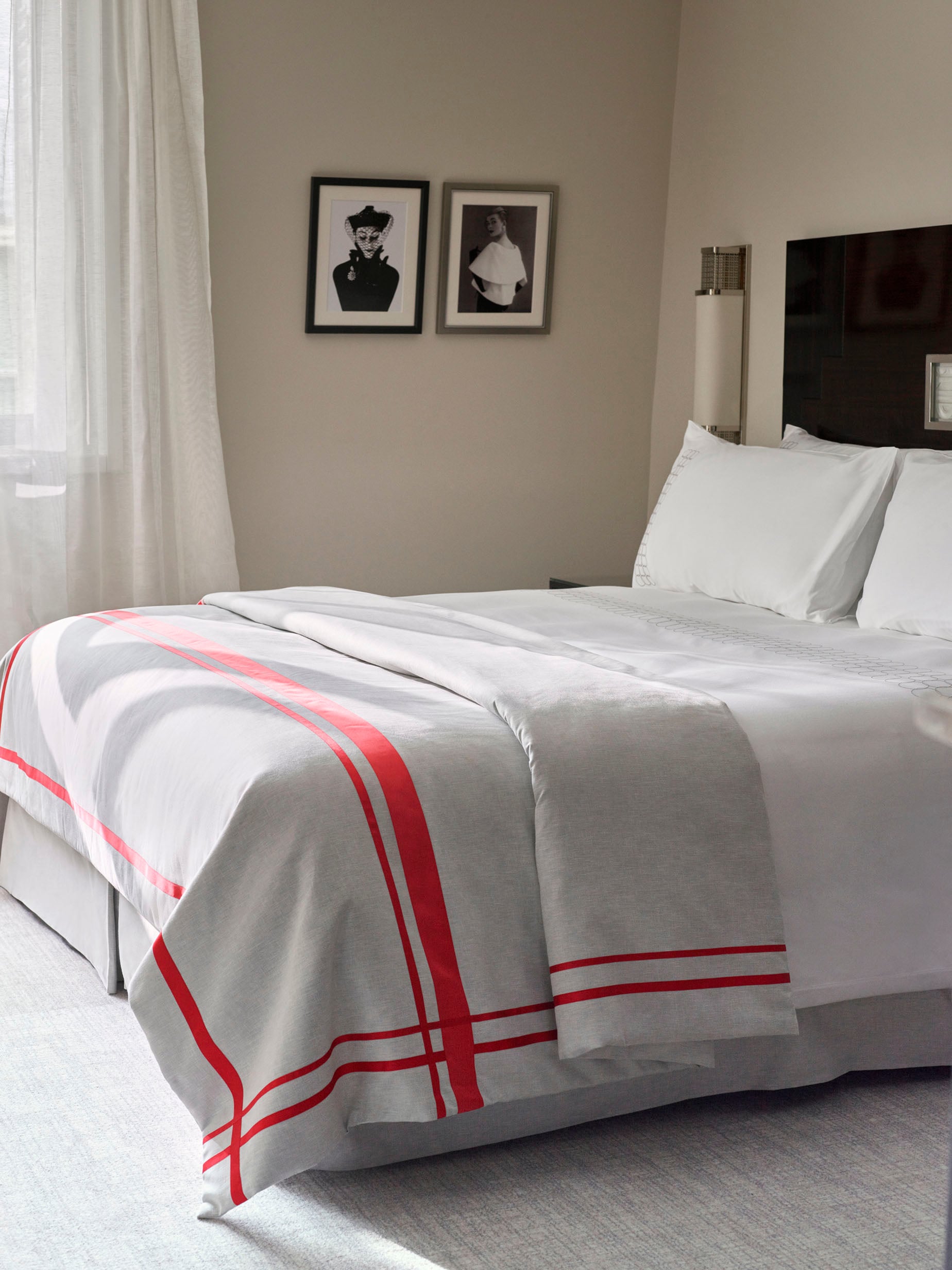 Photo of the bed in the superior rooms with an art deco style