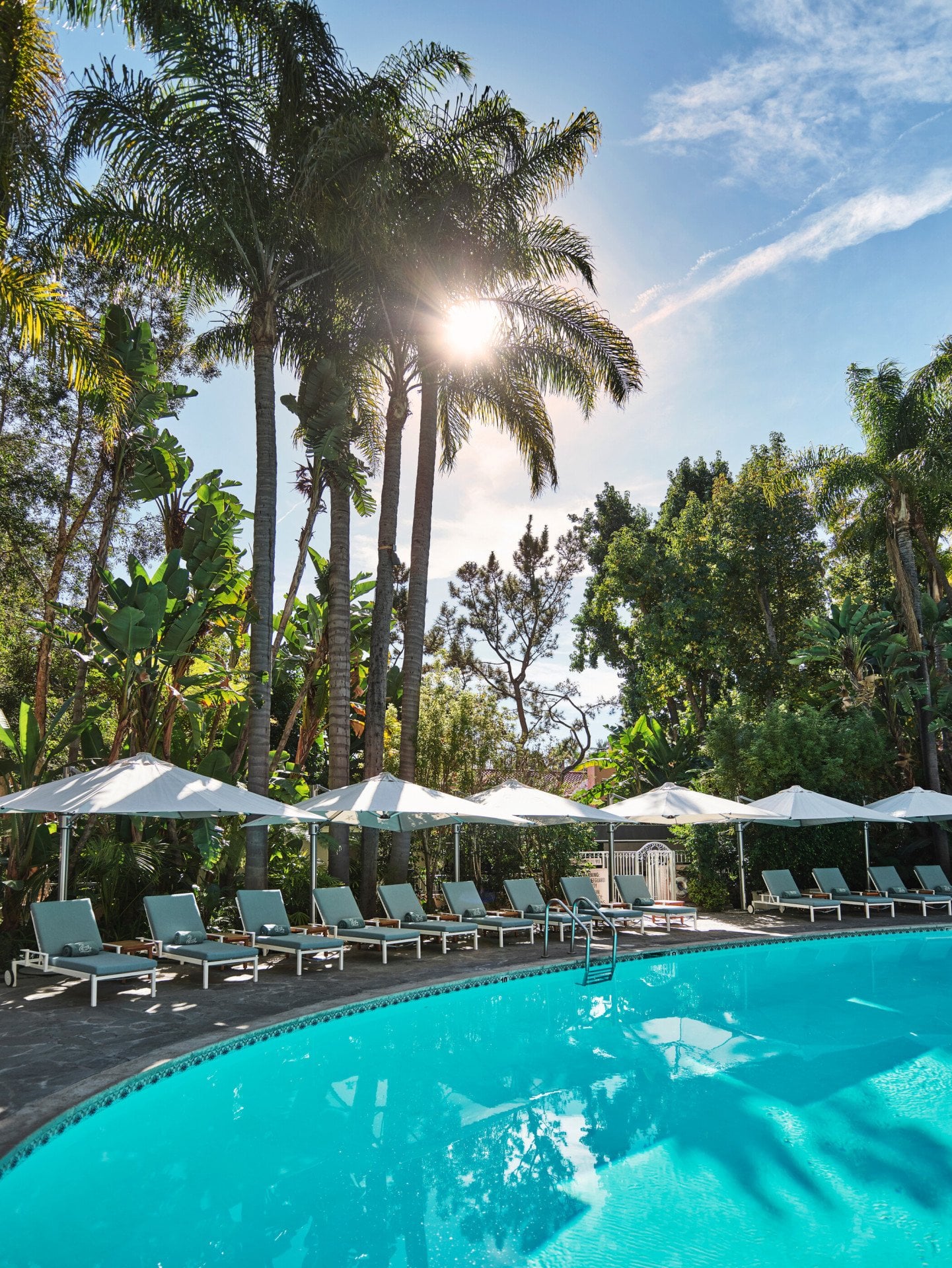 Chairs surrounding oval pool at Hotel Bel-Airs