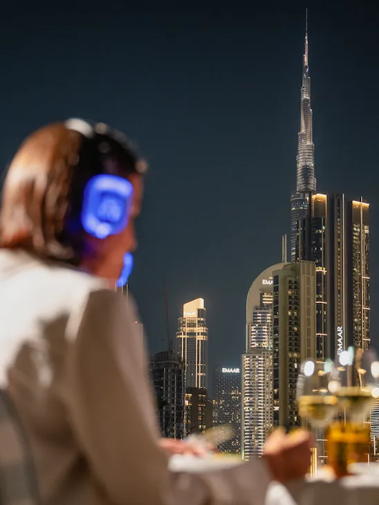 Guests enjoying the Riviera Cinema club experience with the views of Burj Khalifa in the back