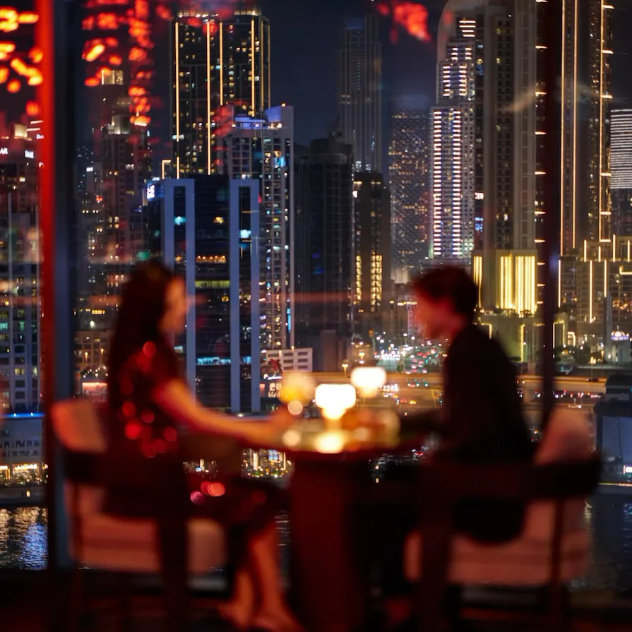 A couple enjoying drinks at Jara by Martin Berasategui