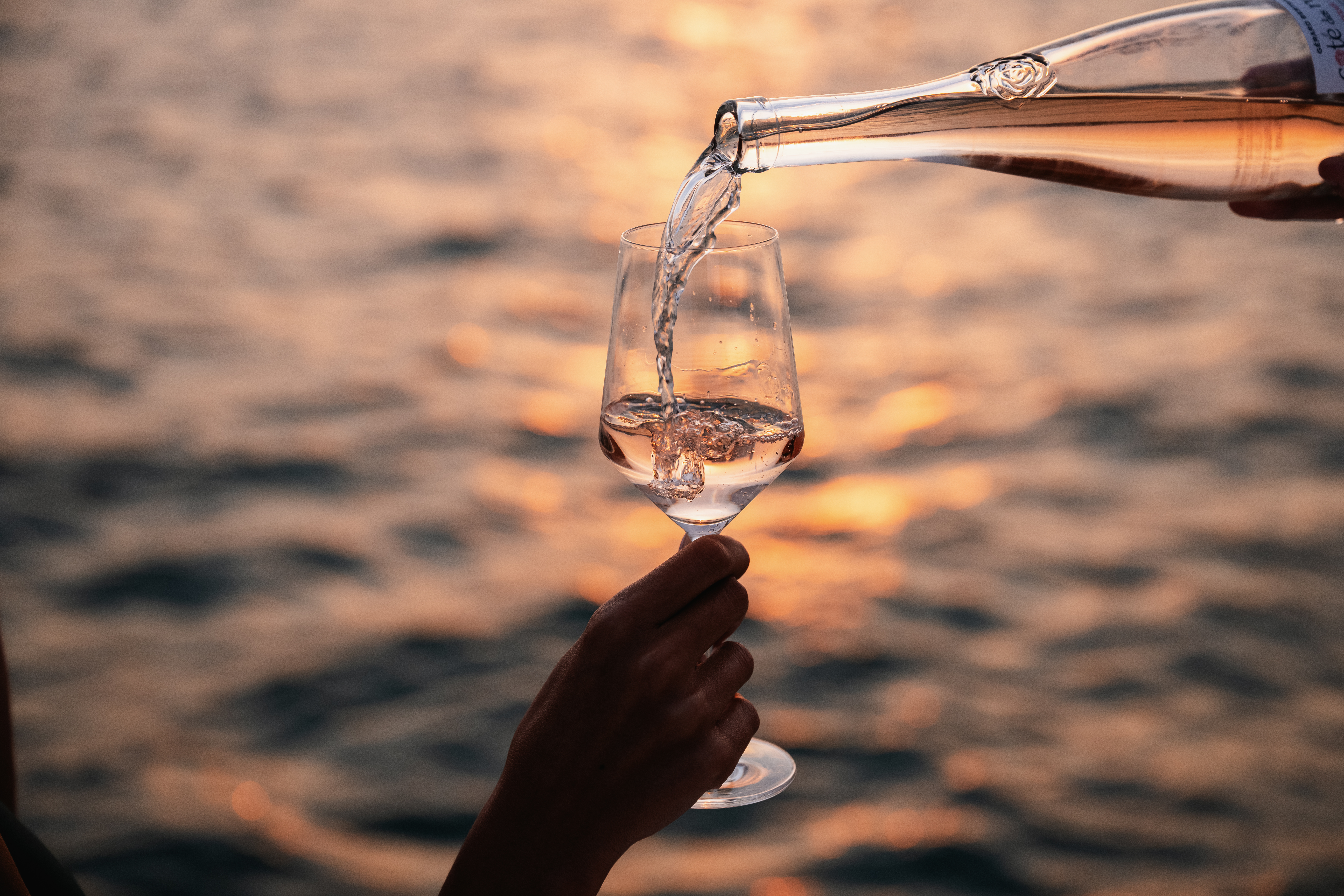 Wine pouring during Sunset