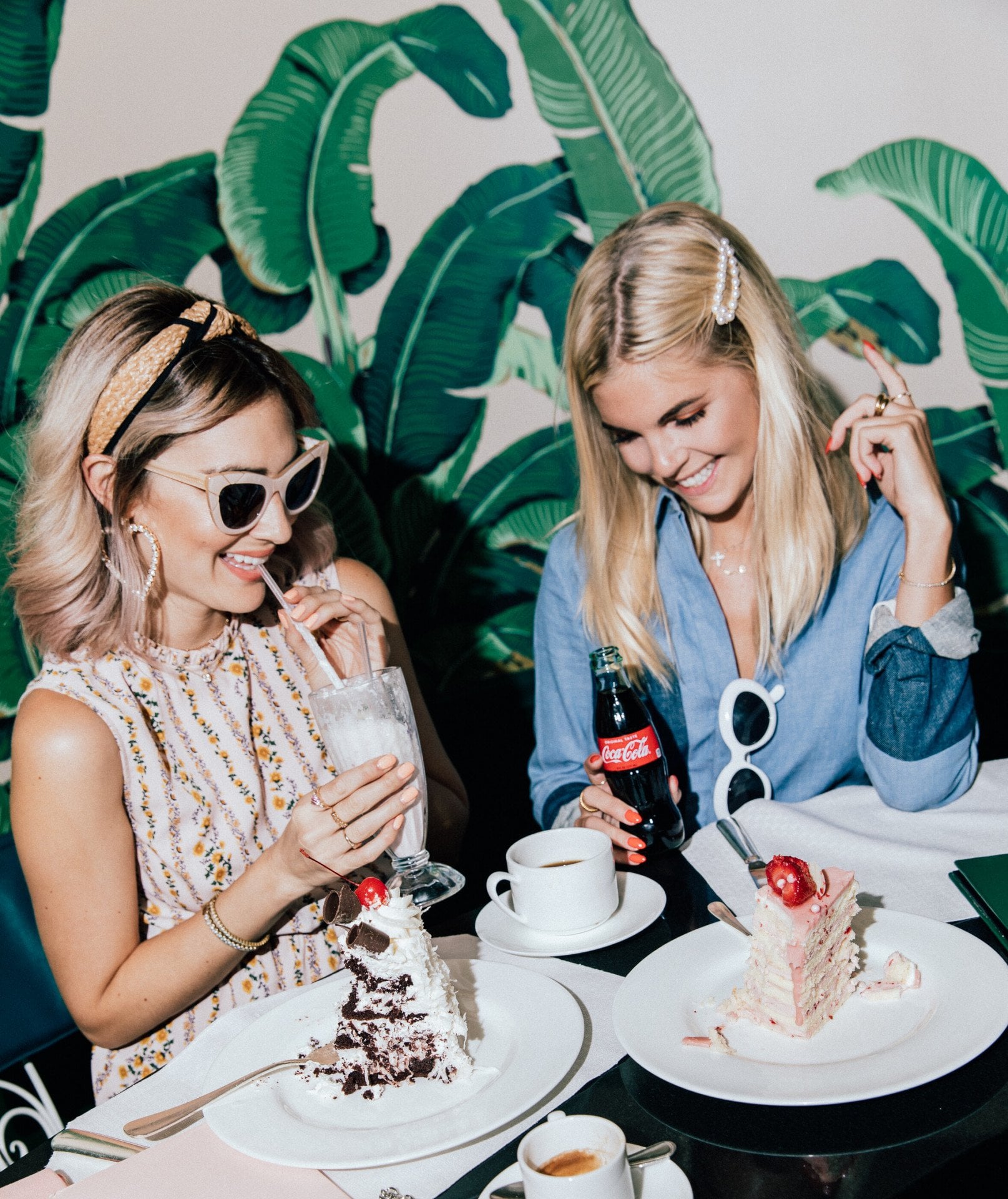 Friends eating cake and drinking milkshakes in The Fountain Coffee Room 