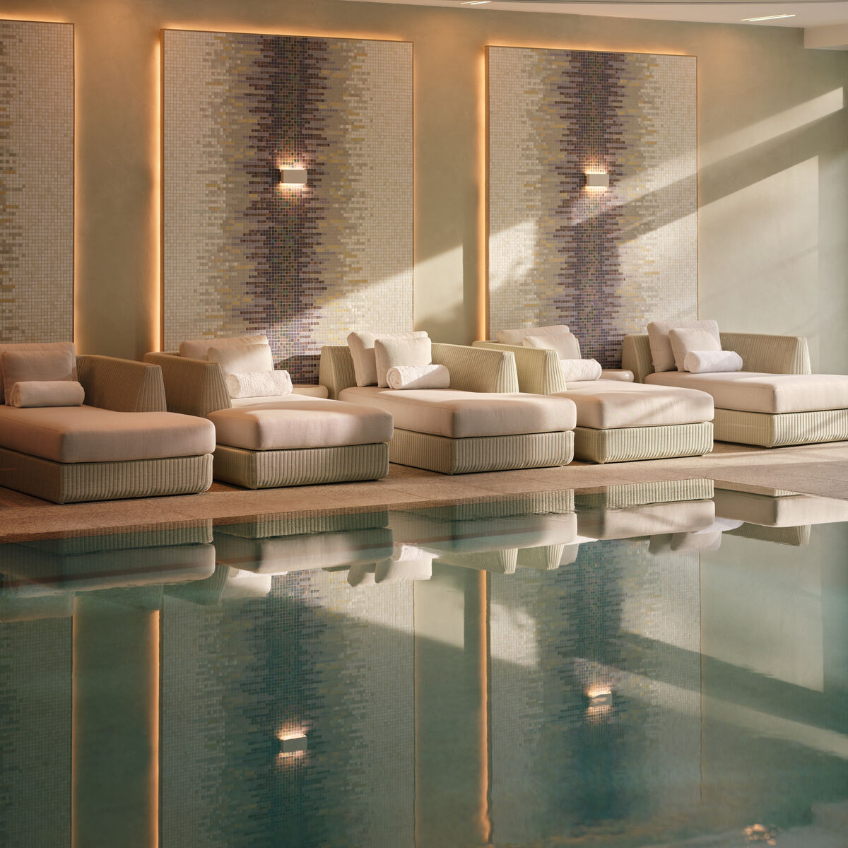 Poolside relaxation loungers at The Spa at Coworth Park