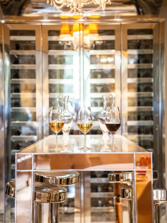 Three glasses of white and red wines in the wine cellar of Restaurant Le Meurice Alain Ducasse, at Le Meurice, Paris.