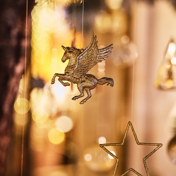 Zoom on Christmas decorations hooked on a Christmas tree, at Le Meurice, Paris