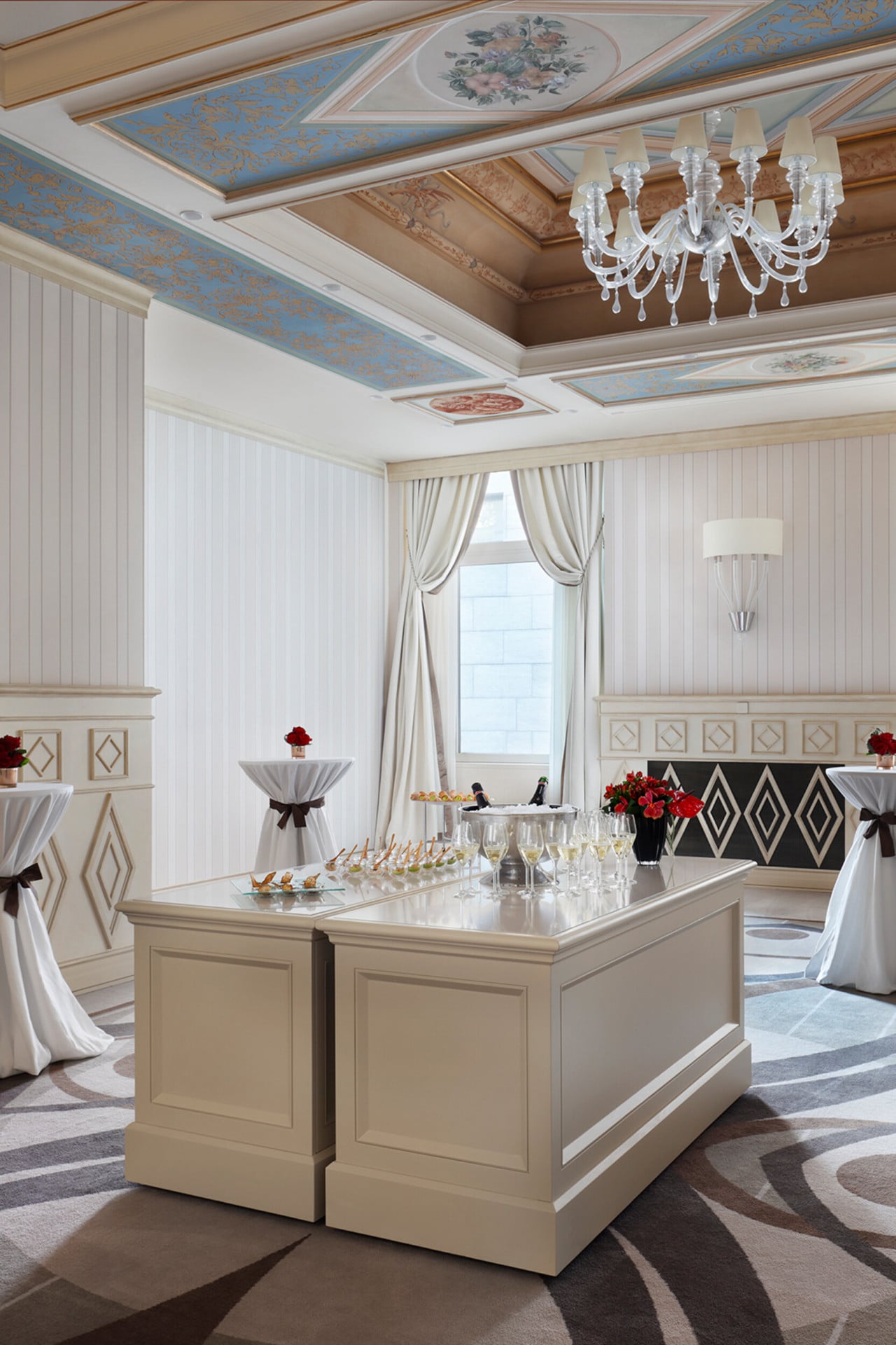 Food and drink station in the Marconi Room. Red floral details on the tables.