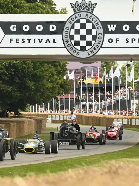 Vintage racing cars on the hill climb at the Goodwood Festival of Speed, near Coworth Park