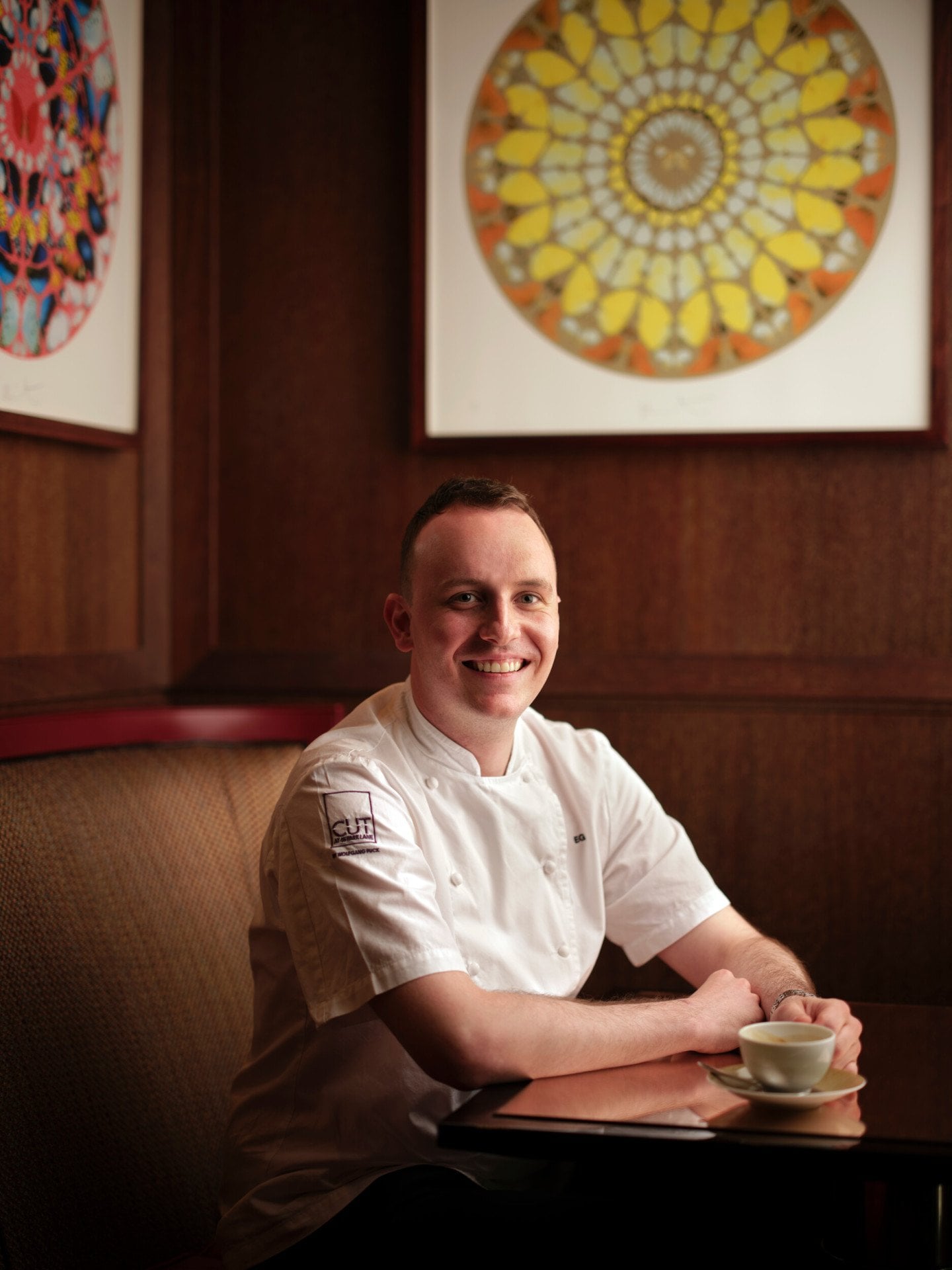 Portrait of Elliott Grover, Executive Chef at 45 Park Lane sat in CUT restaurant