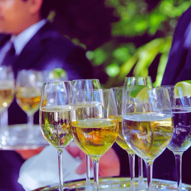 Close-up view of champagne glasses on a tray from a banquet event at Hotel Bel-Air.