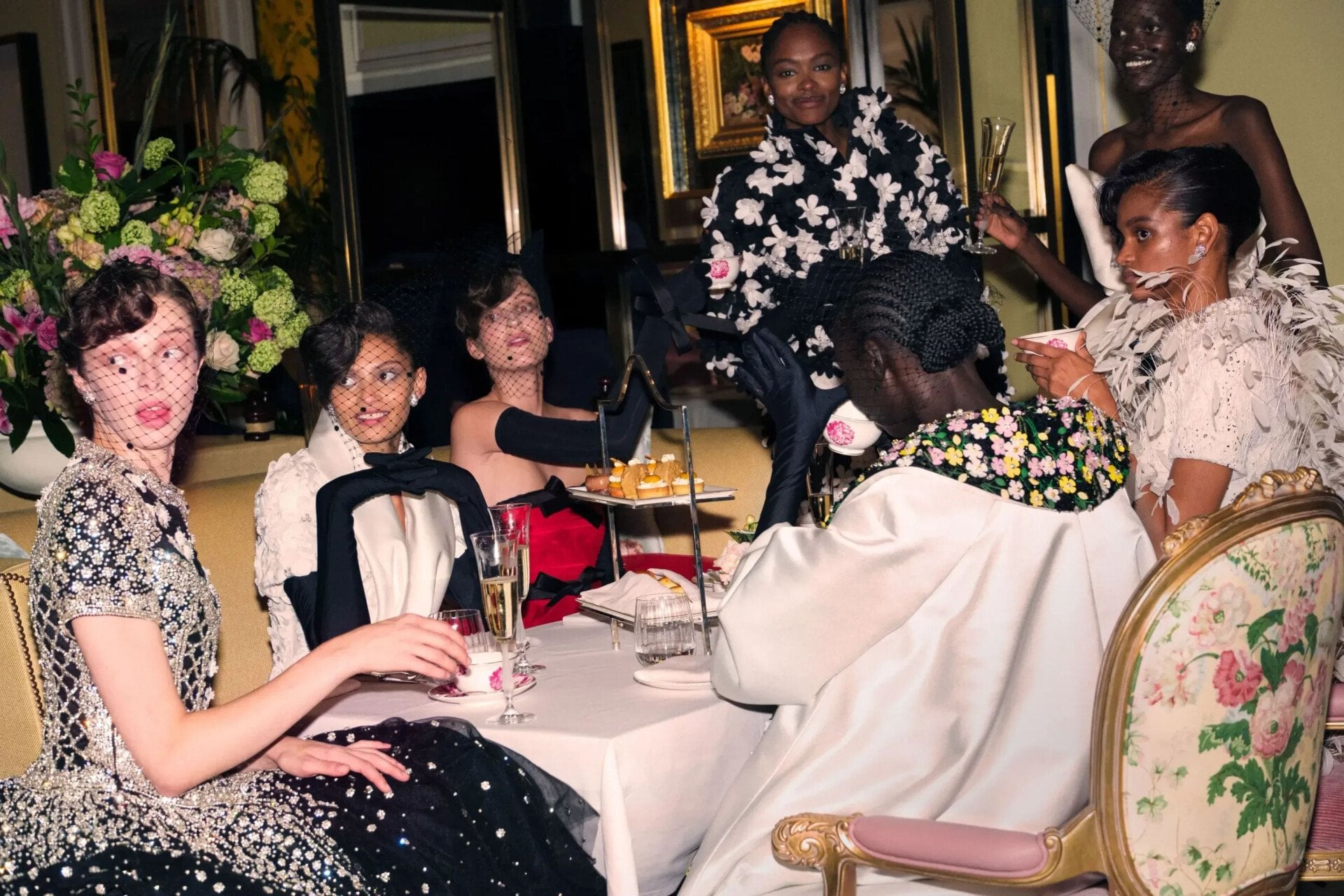 Female models enjoying aftrenoon tea experience at The Dorchester hotel. 