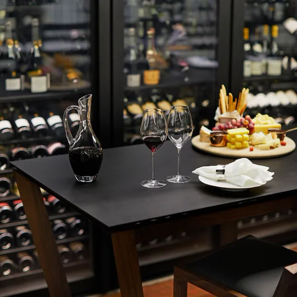 The Dorchester The Wine Vault, red wine being poured and cheese and fruit