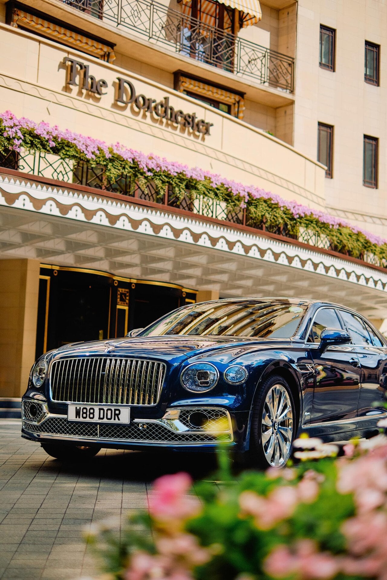 The Dorchester Bentley outside the front of The Dorchester in the sunshine