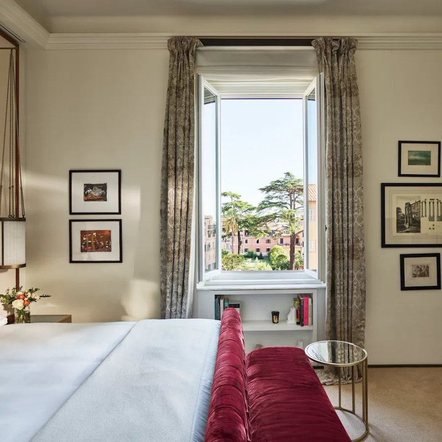 Dolce Vita Suite bedroom with view of Rome at Hotel Eden