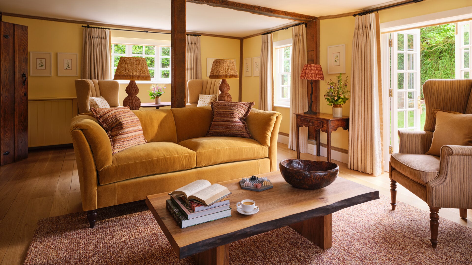 Dower House living room at Coworth Park with warm furnishings and garden views