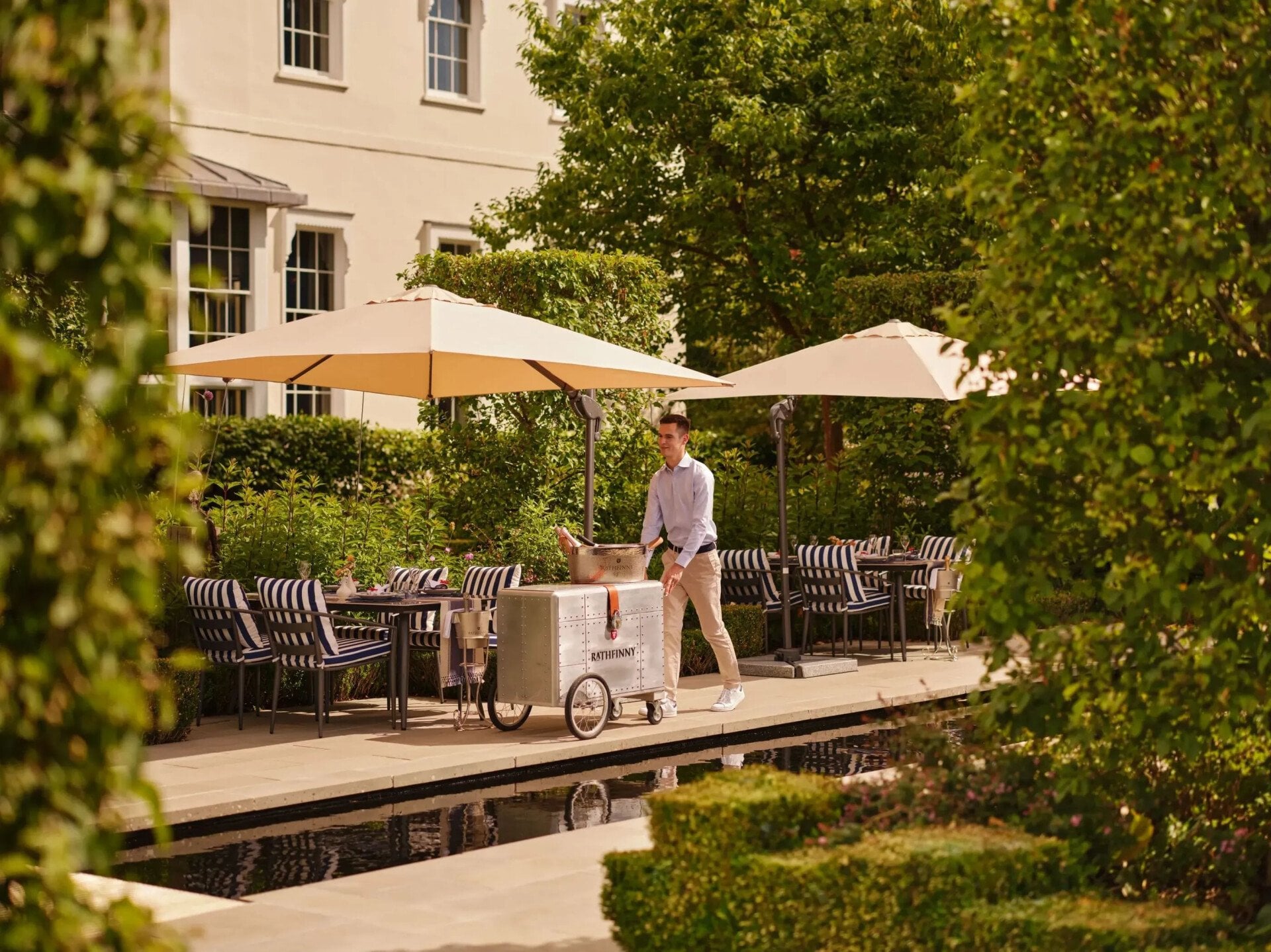 Tide Summer Terrace at Coworth Park with poolside dining and ice cream cart 
