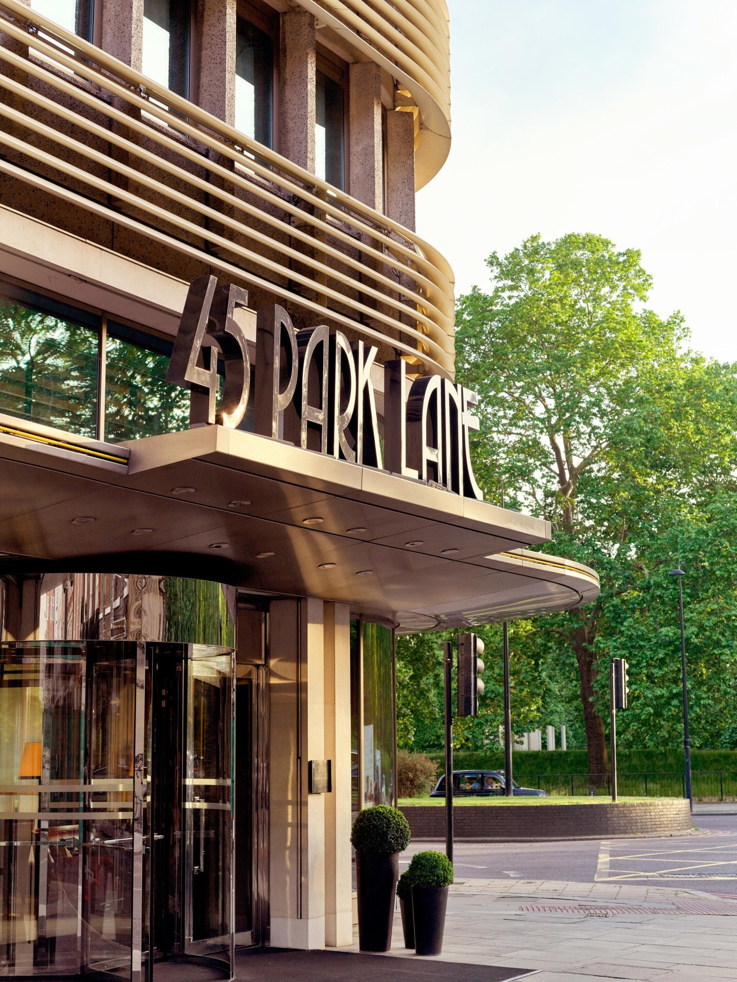 The exterior entrance of 45 Park Lane, London in daytime