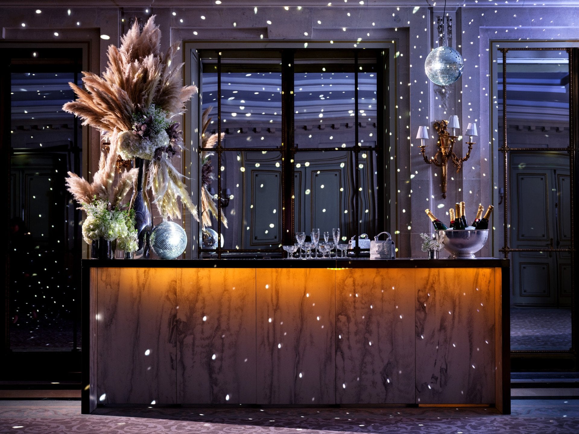 Disco atmosphere at the bar, decorated with pampa and disco ball in the salon Tuileries at Le Meurice, Paris - Dorchester Collection
