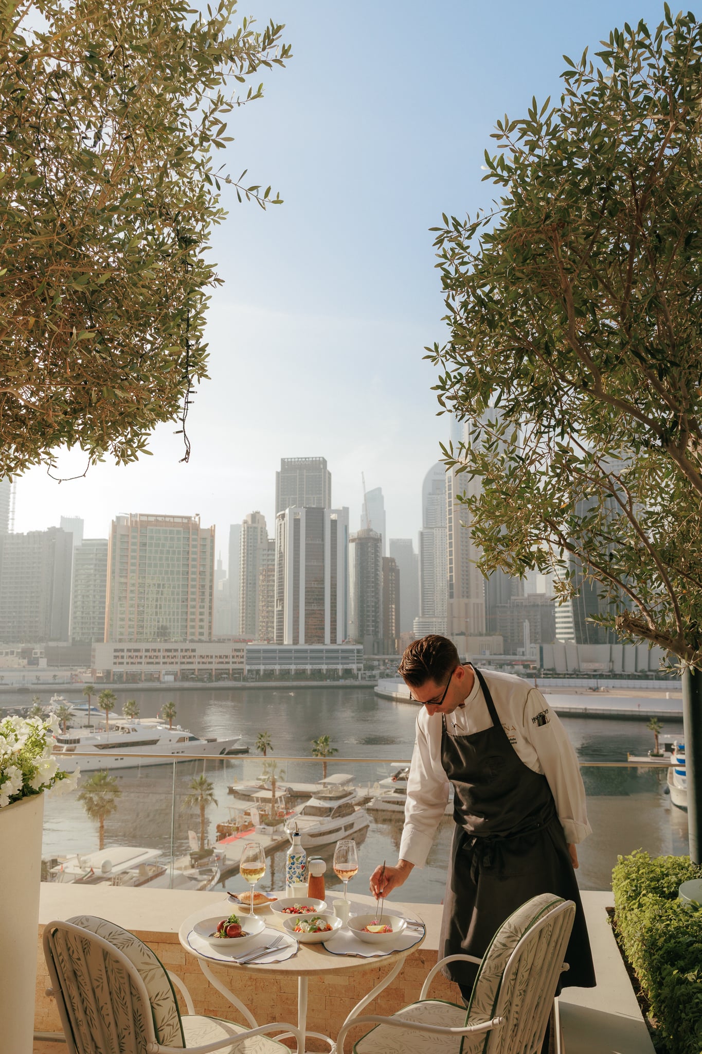 Chef putting the last details in his dish in Riviera terrace