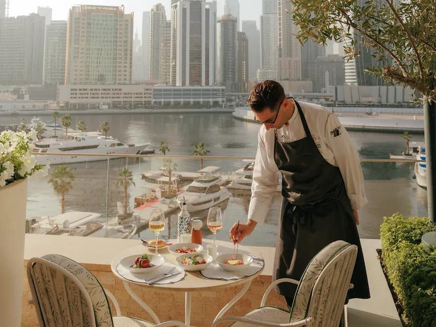Chef putting the last details in his dish in Riviera terrace