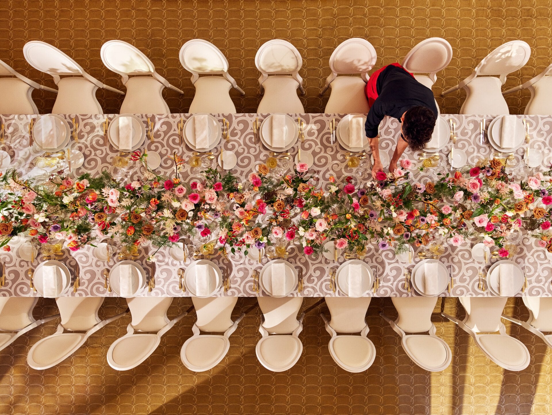 Table captured from the top with colorful flower arrangement at Le Salon Organza, Hôtel Plaza Athénée, Paris - Dorchester Collection.