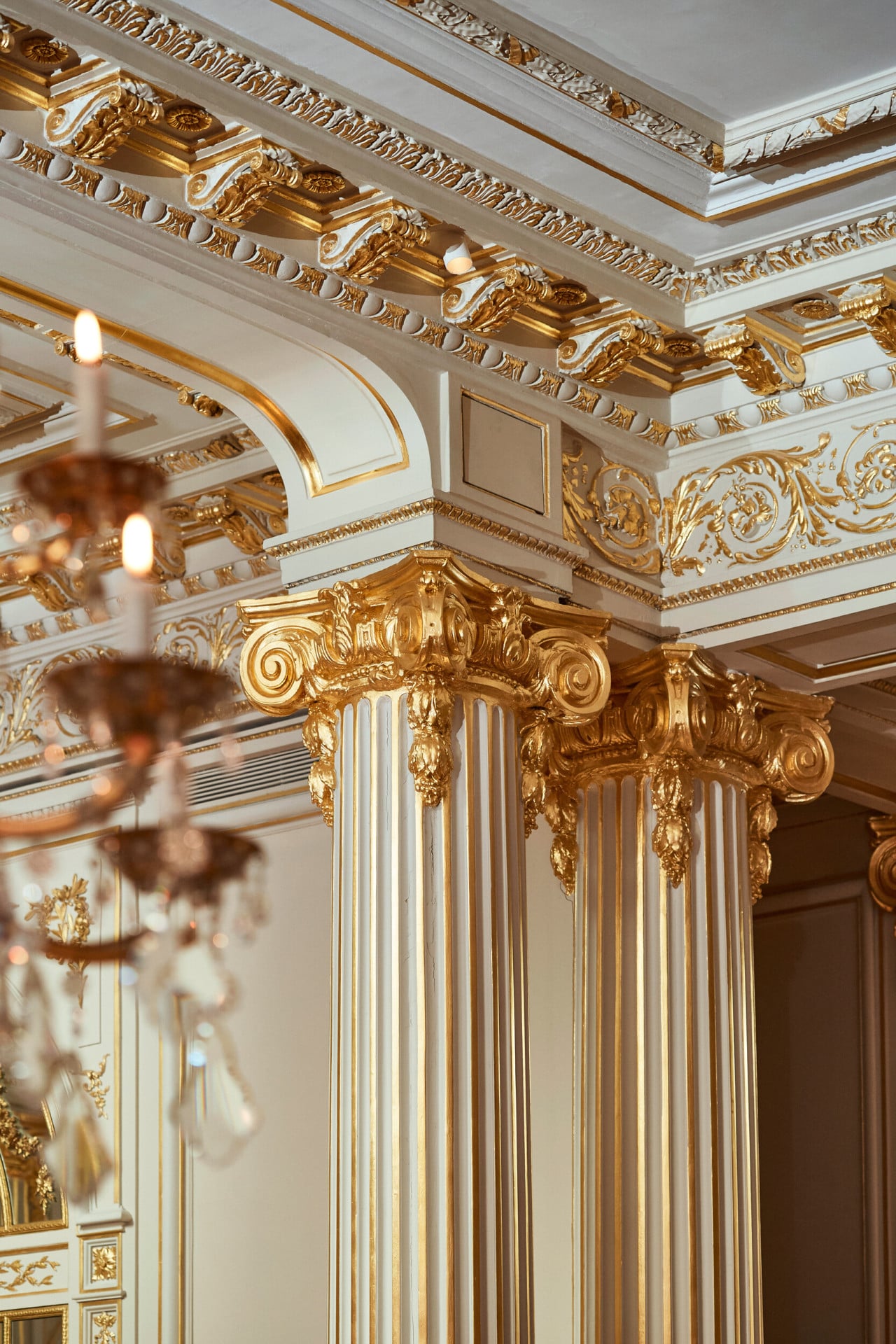 Golden columns of the Jean Imbert au Plaza Athénée dining room, at Hotel Plaza Athénée, Paris